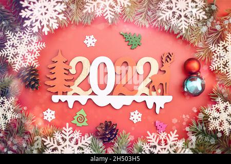 Christmas minimalism holidays composition on red background with copy space for your text 2022 Stock Photo