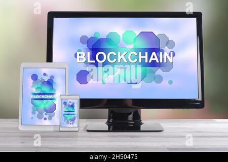Blockchain concept shown on different information technology devices Stock Photo