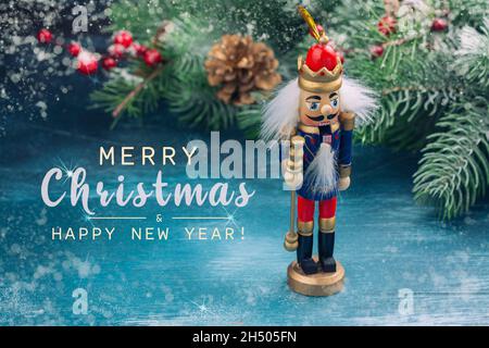 Christmas nutcracker toy soldier on Christmas background with fir tree branches, nuts, xmas balls. Christmas of New Year Greeting Card. Copy space Stock Photo