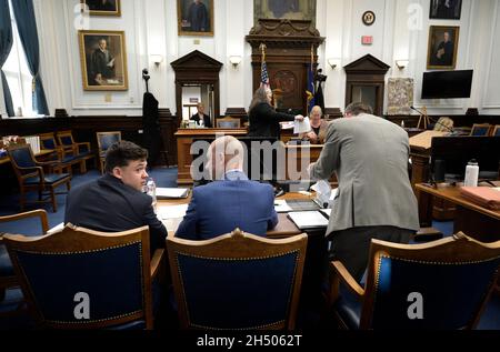 Kenosha, Wisconsin, USA. 5th Nov, 2021. Kyle Rittenhouse, left, and his attorneys, Core Chirafisi, center, and Mark Richards prepare for the start of the day during his trial at the Kenosha County Courthouse in Kenosha, Wis., on Friday, Nov. 5, 2021. (Credit Image: © Sean Krajacic/The Kenosha News-POOL via ZUMA Press Wire) Credit: ZUMA Press, Inc./Alamy Live News Stock Photo