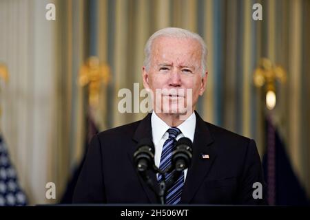 Washington, USA. 05th Nov, 2021. U.S. President Joe Biden speaks on the October jobs report in the State Dining of the White House in Washington, DC, U.S., on Friday, Nov. 5, 2021. The U.S. labor market got back on track last month with a larger-than-forecast and broad-based payrolls gain, indicating greater progress filling millions of vacancies as the effects of the delta variant faded. Photographer: Al Drago/Pool/Sipa USA Credit: Sipa USA/Alamy Live News Stock Photo
