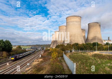 Ratcliffe on Soar. Nottingham, UK. 5th Nov, 2021. Ratcliffe Power Station was spewing out tons of emissions today as a train leaves East Midlands Parkway. It comes as the COP26 summit is taking place in Glasgow, UK, where climate activist Greta Thunberg led thousands of young people in a protest calling for action on climate change. Credit: AG News/Alamy Live News Stock Photo