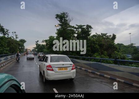 Howrah, West Bengal, India - 4th August 2020 : Image shot through car, traffic at 2nd Hoogly bridge. Monsoon stock image. Stock Photo