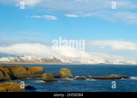 View from Arnarstapi, looking east along the south coast of the Snæfellsnesnes peninsula in the Western part of Iceland Stock Photo