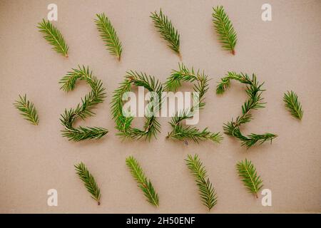 Lightbox with 2022 numbers handmade from Christmas tree branches. Stock Photo