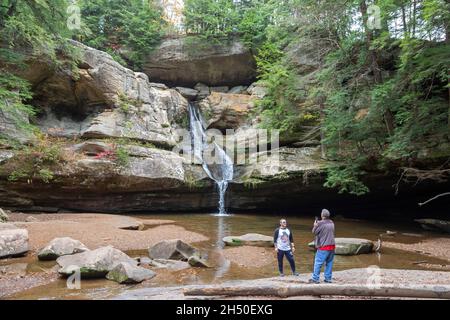 Logan, Ohio - Visitors take photos at Cedar Falls in Hocking Hills State Park. Stock Photo