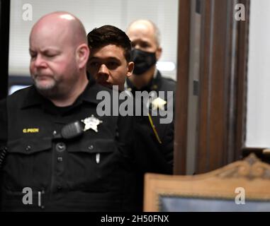 Kenosha, Wisconsin, USA. 5th Nov, 2021. Kyle Rittenhouse, center, is lead back into the courtroom by sheriff's deputies after a break during his trial at the Kenosha County Courthouse in Kenosha, Wis., on Friday, Nov. 5, 2021. (Credit Image: © Sean Krajacic/The Kenosha News-POOL via ZUMA Press Wire) Credit: ZUMA Press, Inc./Alamy Live News Stock Photo