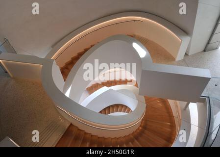 Spiral Staircase Reflected in Rotating Ceiling Mirror inside the LUMA Tower, Art Gallery & Arts Centre, designed by Frank Gehry, Arles Provence France Stock Photo
