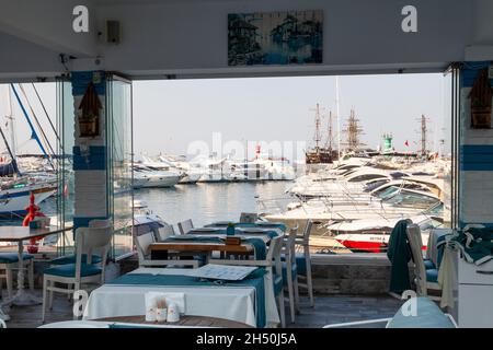 Cafe, outdoor restaurant on the embankment by the sea. Kemer Turkey 08. 25. 2021 Stock Photo