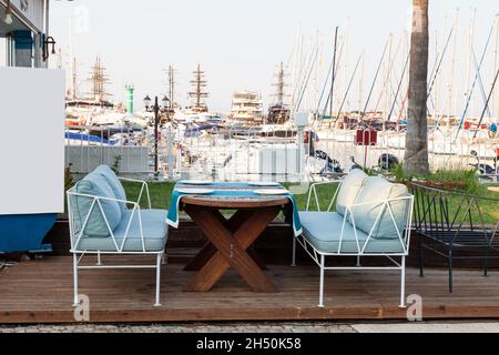 Cafe, outdoor restaurant on the embankment by the sea. Kemer Turkey 08. 25. 2021 Stock Photo