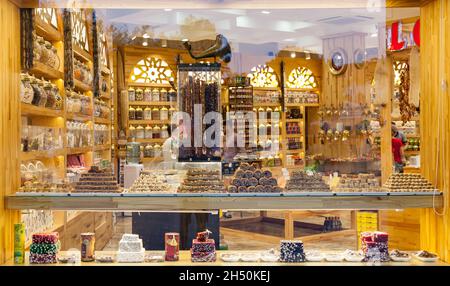 Kemer, Turkey - 08. 25. 2021: In front of store selling Turkish delight, various locum, arranged like pyramid, with knives, colorful sweets, ready to Stock Photo