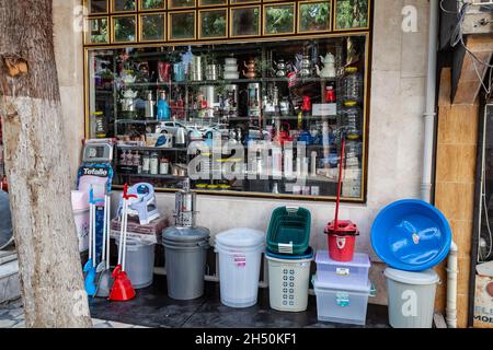 Esilova, Turkey - 08. 28. 2021: A showcase of a private store with a lot of different household goods on a shopping street in a small town in Turkey. Stock Photo