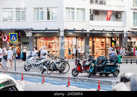 Kemer, Turkey - 08. 25. 2021: rental motorbike and tricycles in the parking lot at the street Stock Photo