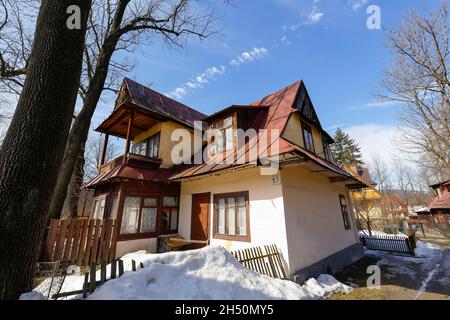 Zakopane, Poland - March 10, 2015: Old residential house built around 1900, made of wood in traditional design, then plastered, listed in the municipa Stock Photo