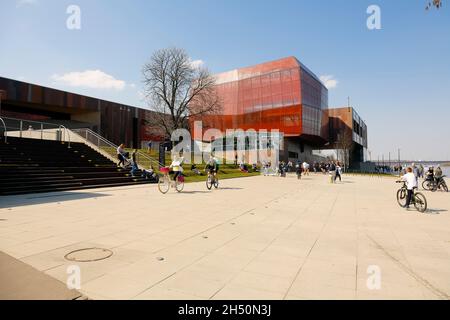 Warsaw, Poland - 08 April 2018: Modernized areas along the Vistula River shoreline, on its western side.  This boulevard is frequently visited by resi Stock Photo