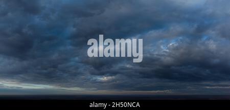 Dark thick clouds in the sky. Abstract panorama with blurred blue clouds Stock Photo