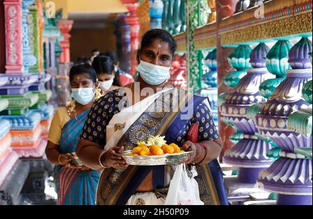 Kuala Lumpur, Malaysia. 04th Nov, 2021. Hindu devotees seen offering prayers at the Batu Caves temple during the festival.Diwali is one of the major religious festivals in Hinduism. The Goddess Lakshmi, the god of wealth is worshiped during Diwali for happiness, prosperity, and fame. Credit: SOPA Images Limited/Alamy Live News Stock Photo