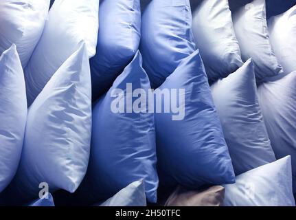 Rows of Many Shades of Blue Tone Pillows on the Shelf Stock Photo