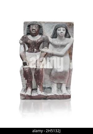 Egyptian statue sculpture of a couple seated, 2350-2200, 6th dynasty, mastaba tomb d'Isi. Louvre Museum E14399. woman seated wering a dress, flared wi Stock Photo