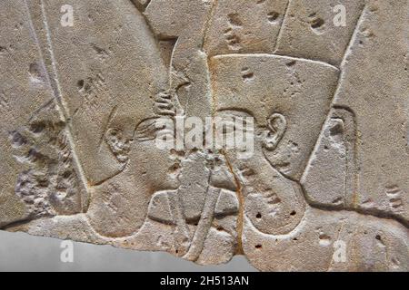 Ancient Egyptian temple relief of a king embracing god Amun, 1279-1213, East Temple Karnac. Louvre Museum B 24 or N134 C. A deity, Amun, embrases the Stock Photo