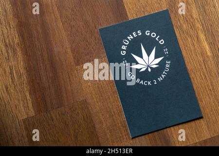Mainz, Rhineland-Palatinate / Germany - February 26. 2020: business card in black with a stylized canabis leaf from a shop called green gold and the m Stock Photo