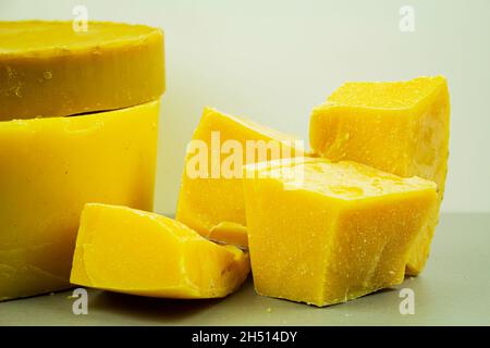 large pieces of natural beeswax, close-up, raw materials for candles Stock Photo