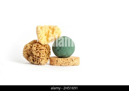 Natural sea sponges and floral sponge on white. Creative concept photography Stock Photo