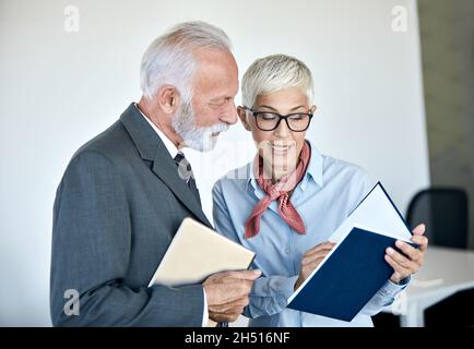 senior busniess people talking office communication Stock Photo