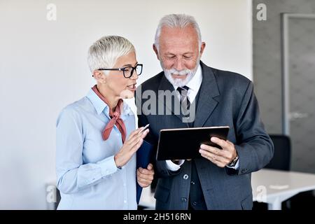 senior busniess people talking office communication Stock Photo