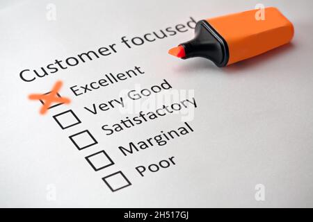 The words customer focused are headed by checkboxes with the terms Excellent, very good, Satisfactory, Marginal, Poor. The word Excellent is marked Stock Photo