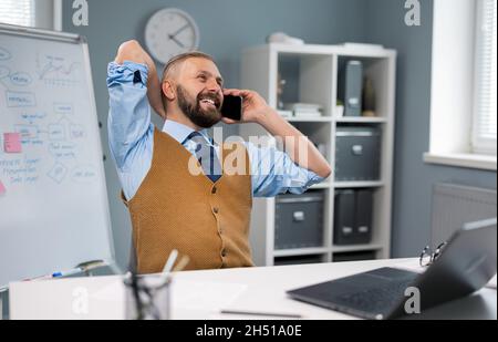Businessman using laptop and mobile Stock Photo