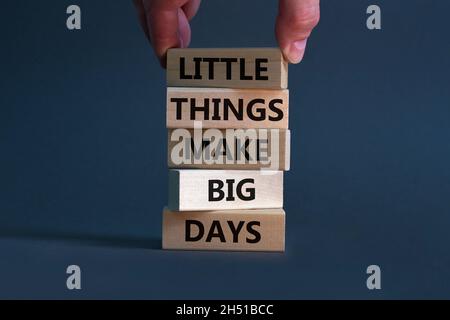 Little things make big days symbol. Wooden blocks with words Little things make big days. Businessman hand. Beautiful grey background, copy space. Bus Stock Photo