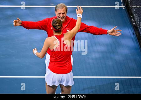 Prague, Czech Republic. 05th Nov, 2021. Non playing captain Heinz Gunthardt and Belinda Bencic of Switzerland celebrate defeating Ajla Tomljanovic of Australia in semifinal match of the women's tennis Billie Jean King Cup (former Fed Cup) in Prague, Czech Republic, November 5, 2021. Credit: Ondrej Deml/CTK Photo/Alamy Live News Stock Photo