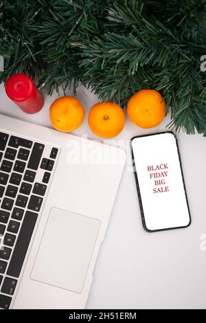black friday sale. special offer discount text on mobile phone screen on seasonal white background Stock Photo