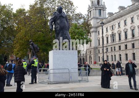 London, UK. 5th Nov, 2021. Million mask march in Parliament Square. Credit: JOHNNY ARMSTEAD/Alamy Live News Stock Photo