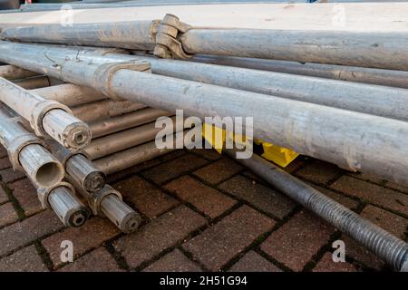 Pile of components of hired scaffolding or mobile platform work tower Stock Photo