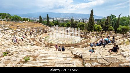 Athens - May 8, 2018: Panorama of old Theatre of Dionysus at Acropolis foot, Athens, Greece. It is tourist attraction of Athens. People visit Ancient Stock Photo