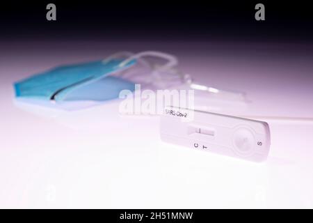 Rapid test device for Covid-19 kit showing negative result. Lab card kit test for coronavirus SARS-CoV-2 virus. Fast test COVID-19 on a lightbox Stock Photo