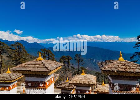 108 Memorial Chortens of Dochula Pass- mountain pass in Himalayas within Bhutan on the road from Thimpu Thimphu to Punakha, Bhutan. Stock Photo