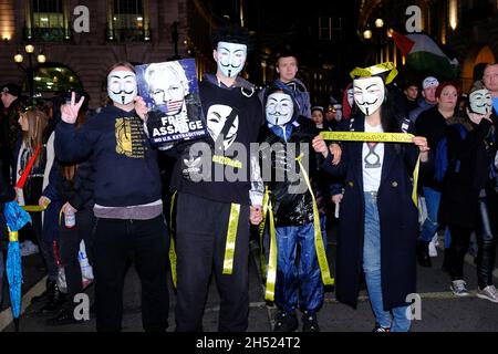 London, UK, 5th Nov, 2021. Protesters gathered for the Million Mask March in central London where numerous fireworks and smoke flares were set off around Parliament Square. Numbers were boosted for the anti-establishment demonstration by anti-vaccine passport protesters joining in this year. Credit: Eleventh Hour Photography/Alamy Live News Stock Photo