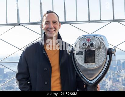 New York, NY - November 5, 2021: Actor Tony Hale attends Empire State Building hosting cast of Clifford the Big Red Dog movie, ESB will be lit in red to celebrate the release of the film Stock Photo