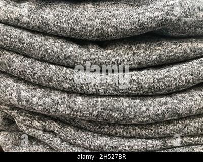 Putting Clothes in to the wardrobe / closet. Stock Photo