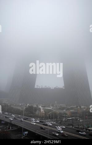 Beijing, China. 06th Nov, 2021. China Central Television CCTV headquarters building in morning mist during polluted day in Beijing, China on 06/11/2021 by Wiktor Dabkowski Credit: dpa/Alamy Live News Stock Photo