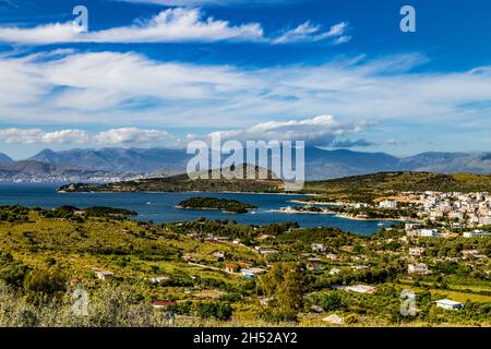 Beautiful landscape Saranda, Albania. View of Ksamil town and beach, small islands in blue Ionian sea and Albanian mountains on the horizon. Sunny sum Stock Photo