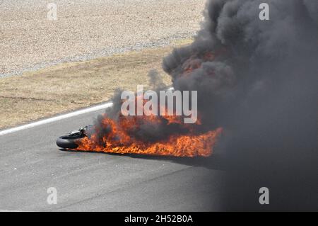 Fire of a motorcycle in the Moto2 race in the Barcelona Catalunya circuit, Montmeló, Spain Stock Photo