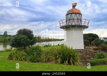 The Portland Island lighthouse (1878) in the town of Wairoa, New Zealand. It sits beside the Wairoa River as a tourist attraction Stock Photo