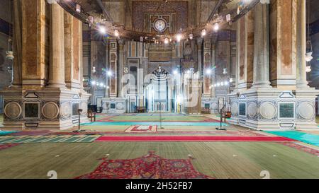 Interior of public historical Al Rifaii Mosque, aka Royal Mosque, with colorful decorated engraved Mihrab and wooden Minbar, Cairo, Egypt Stock Photo