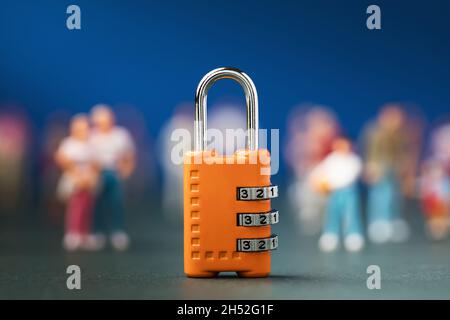 Closed castle on the background of people, the concept of a society under lock and key Stock Photo