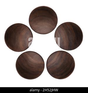 A combination of five handmade black walnut small round trays. Stock Photo
