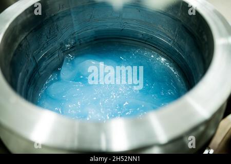 Mixer full of blue gel. Silicon product, medicine, health care industry. Stock Photo